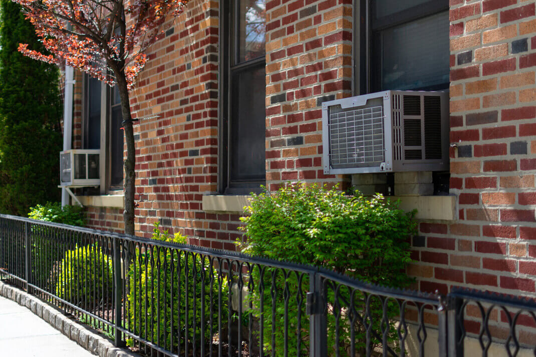 Outdoor Window Air Conditioning Units on an Old Brick Apartment