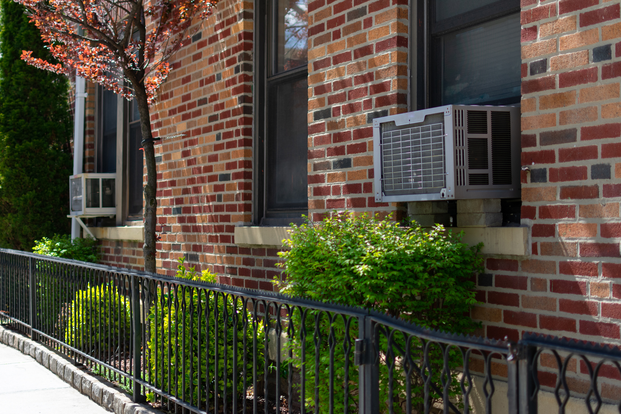 Outdoor Window Air Conditioning Units on an Old Brick Apartment 