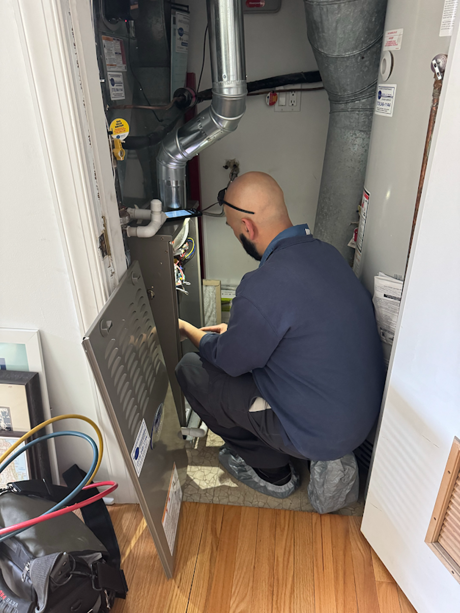 Deljo tech conducting HVAC tune-up