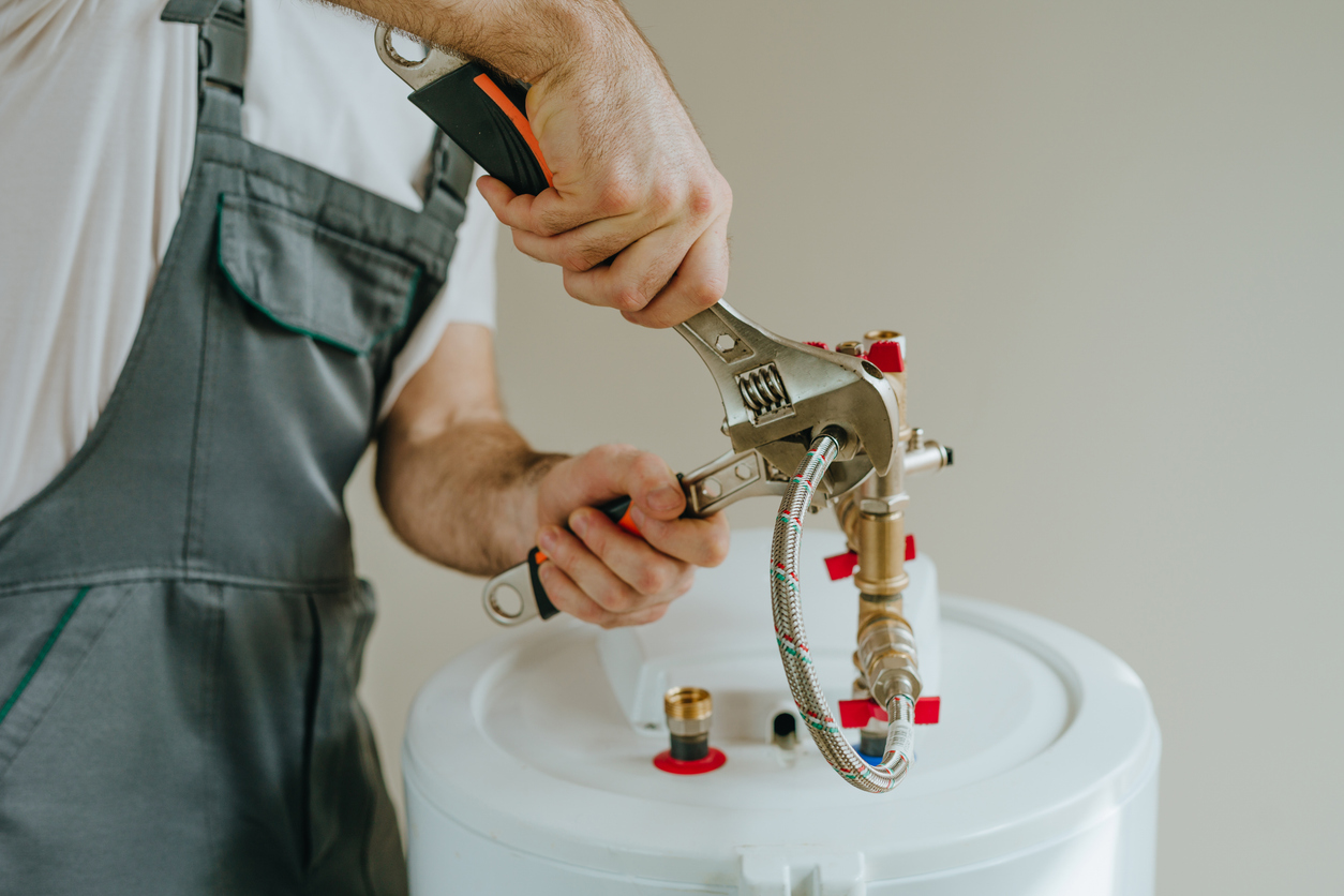 Man fixing water heater.