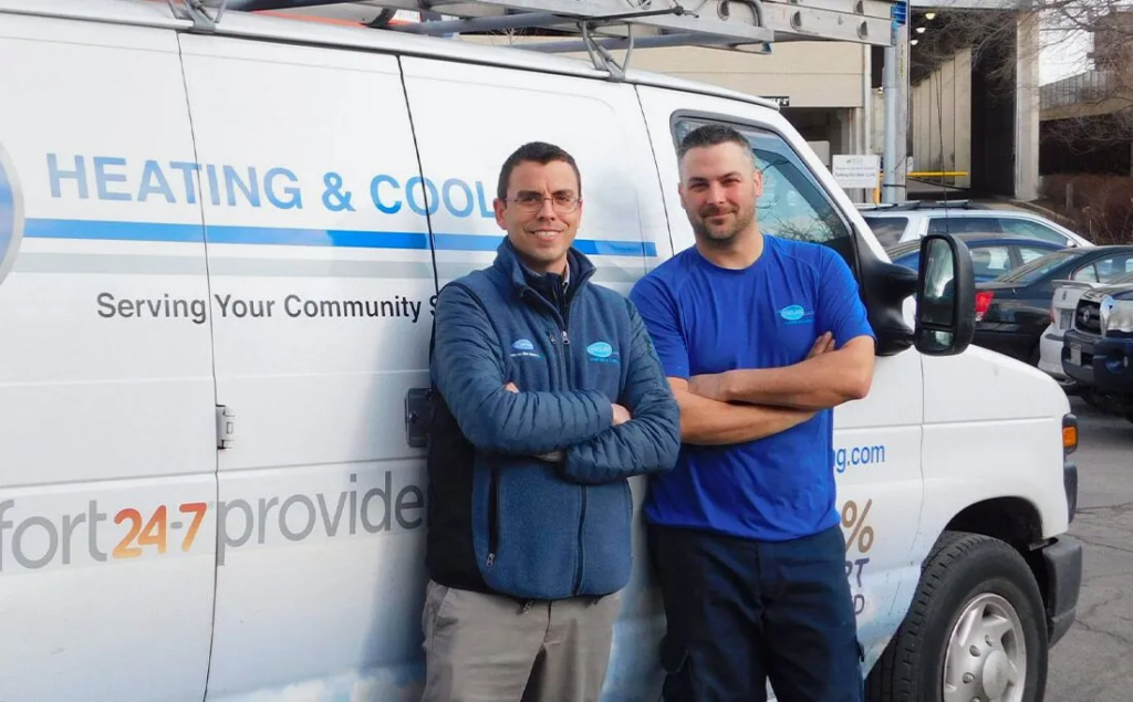 technicians in front of truck